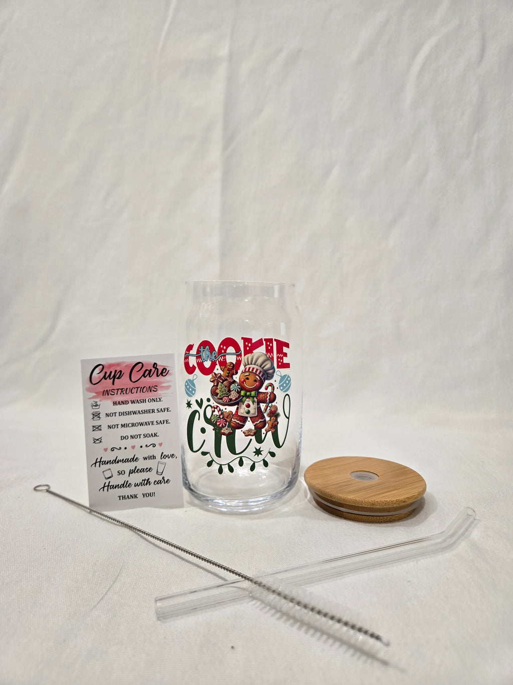 Christmas Glass Cup, 17.58 oz, "Cookie Crew" Gingerbread man wearing a bakers hat with cookies