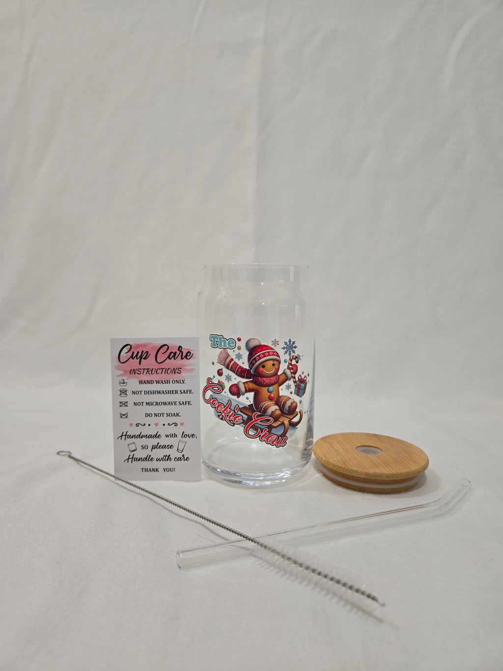 Christmas Glass Cup, 17.58 oz, Gingerbread man on a sled, wearing a red cap and scarf, "Cookie Crew"
