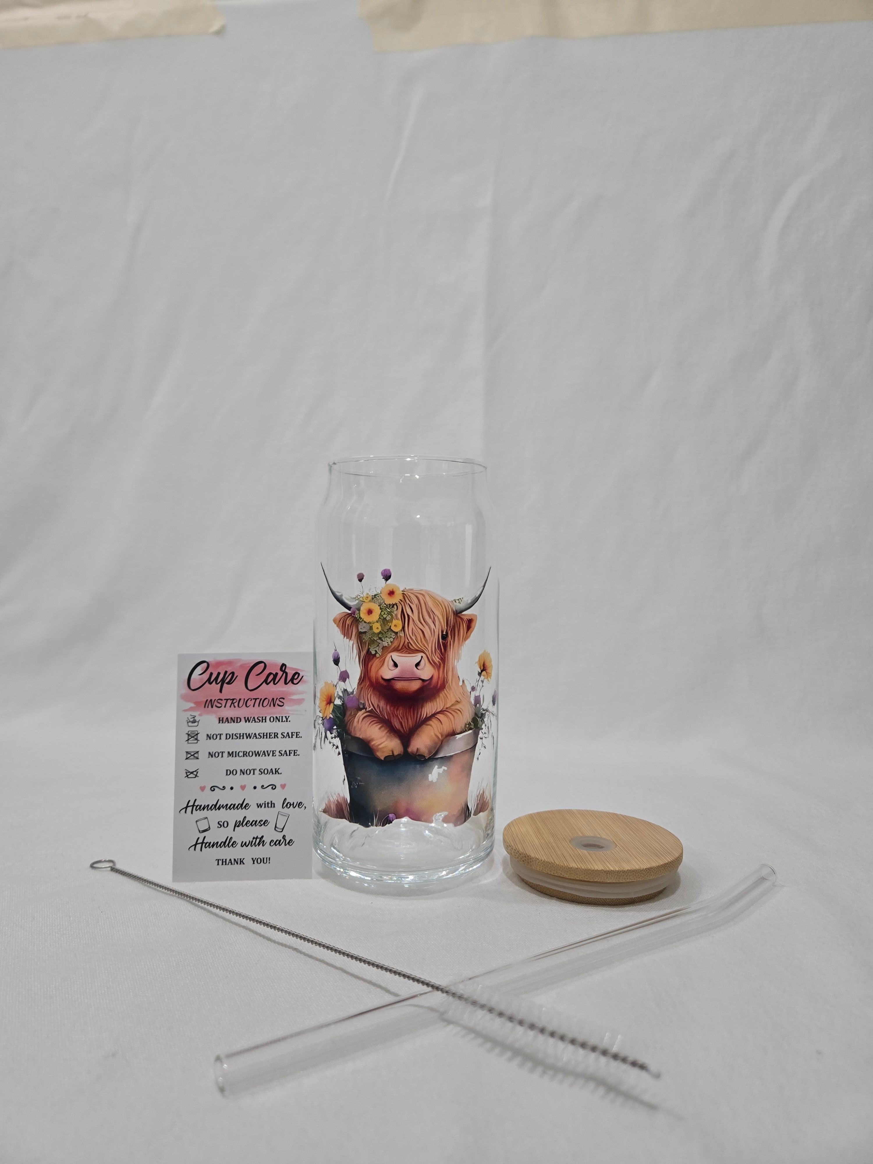 Highland Cow Glass Cup, 20 oz, cow in a bucket with flowers around