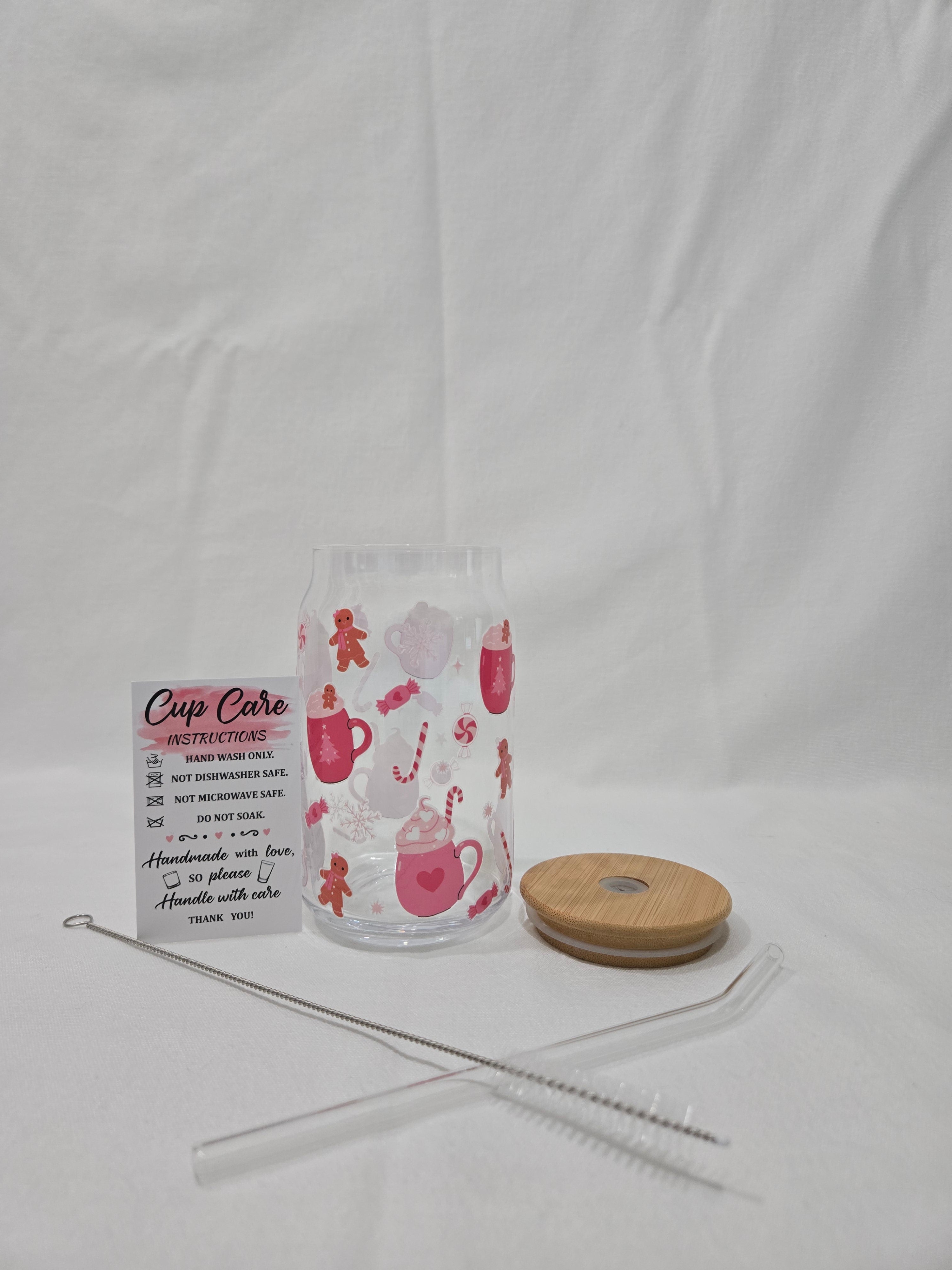 A Pink Winter glass cup, 17.58 oz, Hot Cocoa filled cups, peppermint candies and gingerbread