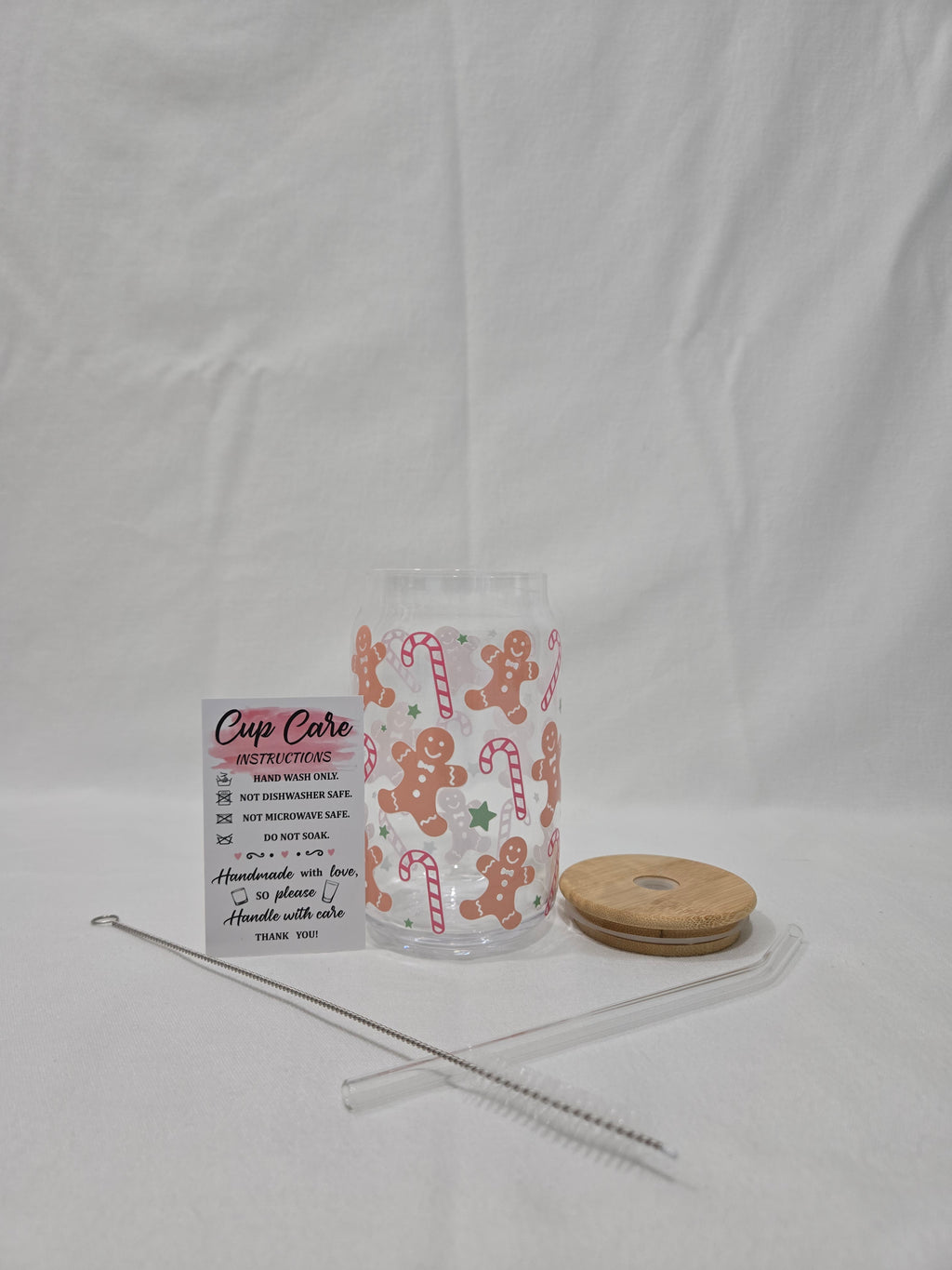 Winter Pink Glass Cup, 17.58 oz, Gingerbread men, candy canes, and stars