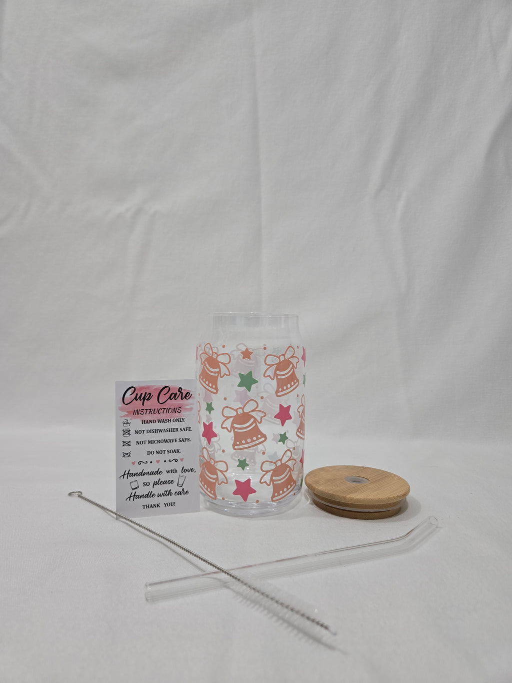 Winter Pink and Brown Glass Cup, 17.58 oz with Bells and Stars